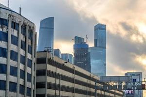 MOSCOW, RUSSIA - JANUARY 04, 2018 View of Moscow City skyscapers and garage complex photo