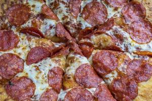 pepperoni pizza closeup, selective focus. photo