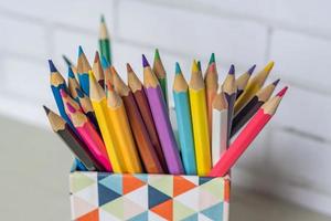 closeup of colorful pencils in pencil case photo