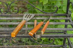 Barbecue tools tongs, carving fork, spatula photo