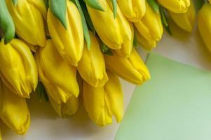 Yellow tulips bouquet close up photo