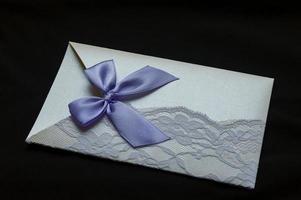wedding invitation on black background photo