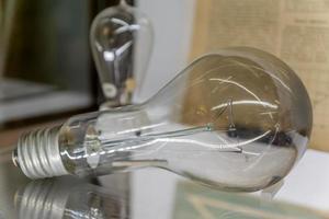 lightbulb on glass shelf photo