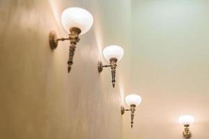 closeup of interior in classig style - brass scones on wall photo