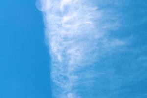 blye sky with white fluffy clouds background photo