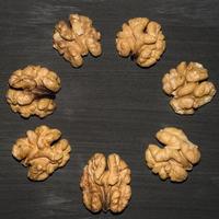 walnuts on black background. Top view with copy space for your text photo