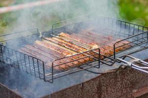 barbeque sausages outdoors photo