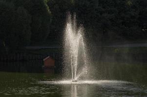 fountain in city pond photo