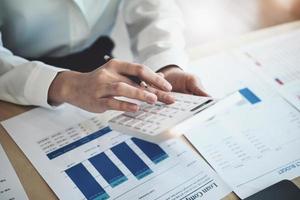 Auditors use budget document calculators to find annual budget disbursement errors. photo