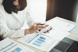 Auditors use budget document calculators to find annual budget disbursement errors. photo