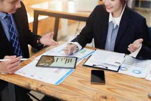 business people working together on a new project to analyze budgets and manage investment risks in today's profit boosting for marketing in the office room photo