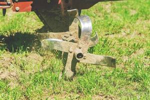 close up of plow of handle tractor for plowing the ground, farming equipment photo