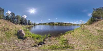 seamless spherical hdri panorama 360 degrees angle view on grass coast of huge river or lake in sunny summer day and windy weather in equirectangular projection with zenith and nadir, VR AR content photo