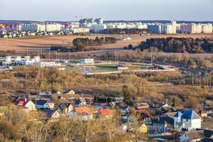 Panoramic view on village building area urban development residential quarter in the evening from a bird's eye view photo