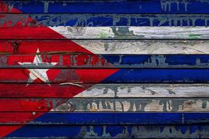 The national flag of Cuba is painted on uneven boards. Country symbol. photo