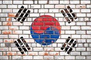 National  flag of the  South Korea   on a grunge brick background. photo