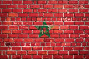 National  flag of the  Morocco  on a grunge brick background. photo