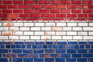 National  flag of the Netherlands  on a grunge brick background. photo