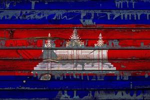 The national flag of Cambodia  is painted on uneven boards. Country symbol. photo