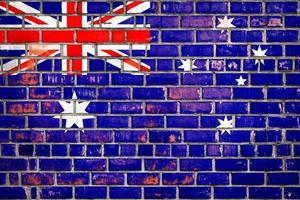 National  flag of the New Zealand on a grunge brick background. photo