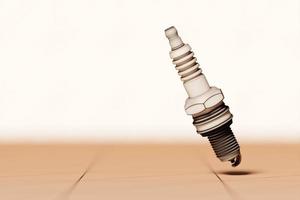 Beige  spark plug on beige  background. 3d illustration. Car Repair Parts photo