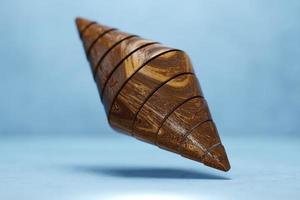 3d illustration of a wooden octahedron on the   blue  background . 3d rendering. Minimalism geometry background photo