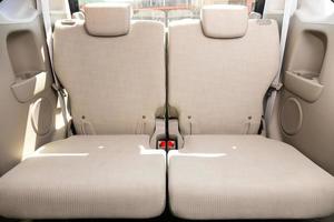 Beige  interior design, car passenger and driver seats with seats belt. photo