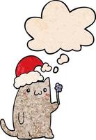 lindo gato de navidad de dibujos animados y burbuja de pensamiento en estilo de patrón de textura grunge vector