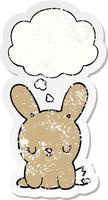 cute cartoon rabbit and thought bubble as a distressed worn sticker vector