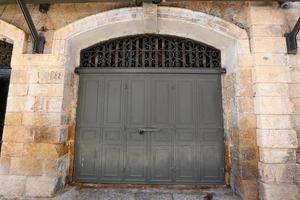 A door is an opening in a wall to enter and exit a building. photo