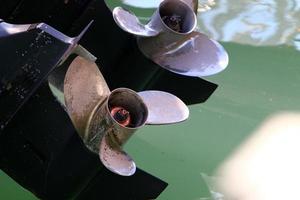 Motor and propeller of a motorboat. photo