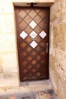 A door is an opening in a wall to enter and exit a building. photo