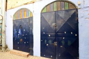 A door is an opening in a wall to enter and exit a building. photo