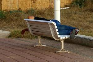 Bench for rest in the city park on the seashore. photo