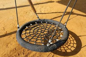 Toys and sports equipment on a playground in Israel. photo