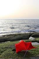 Umbrella for shelter from the sun on the city beach. photo