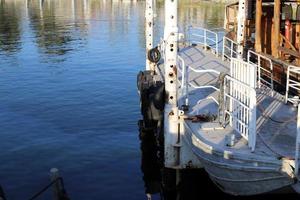 Berth for mooring boats and yachts on the seashore. photo