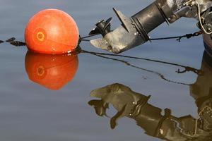 Motor and propeller of a motorboat. photo