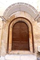 A door is an opening in a wall to enter and exit a building. photo