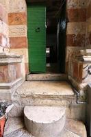 A door is an opening in a wall to enter and exit a building. photo