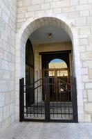 A door is an opening in a wall to enter and exit a building. photo