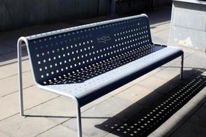 Bench in a city park on the Mediterranean coast photo