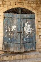 A door is an opening in a wall to enter and exit a building. photo
