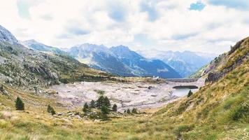 Dam with reservoir drained by drought photo