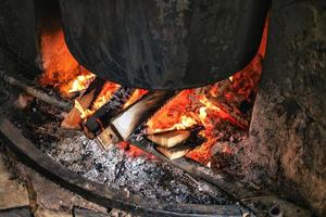 Wood fire under pot photo