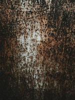 Old metal rust corrosion shabby texture background, dark worn iron brown color, vintage grunge backdrop. photo