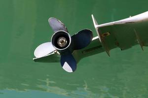 Motor and propeller of a motorboat. photo
