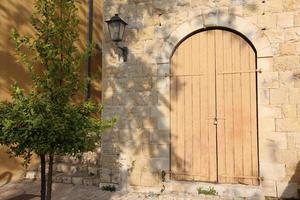 A door is an opening in a wall to enter and exit a building. photo