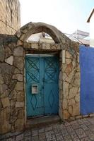 A door is an opening in a wall to enter and exit a building. photo