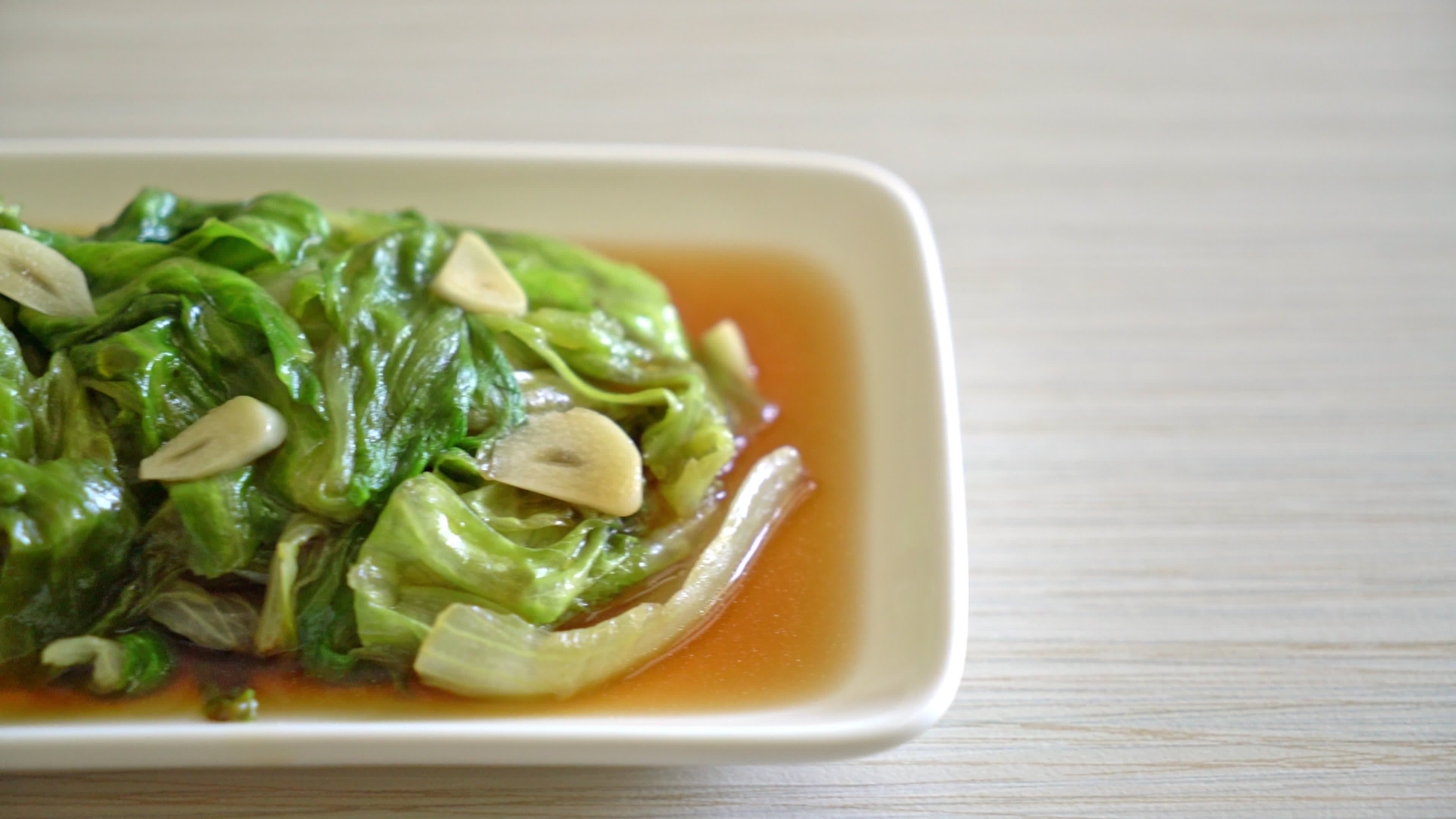 Stir fried Iceberg lettuce with Oyster sauce Healthy food style 10012433 Stock Video at Vecteezy